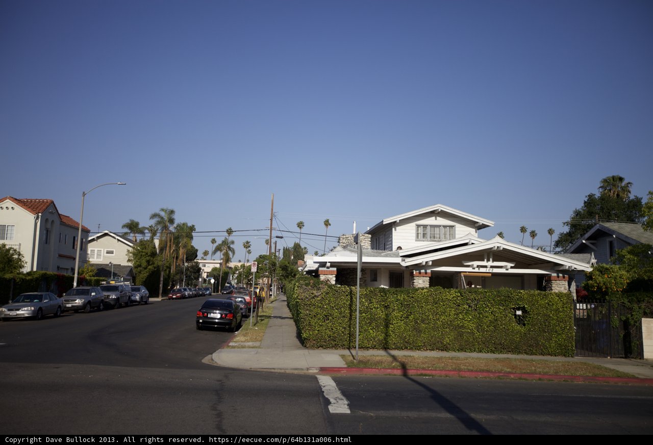 A Quiet Neighborhood Street Lined with Cars