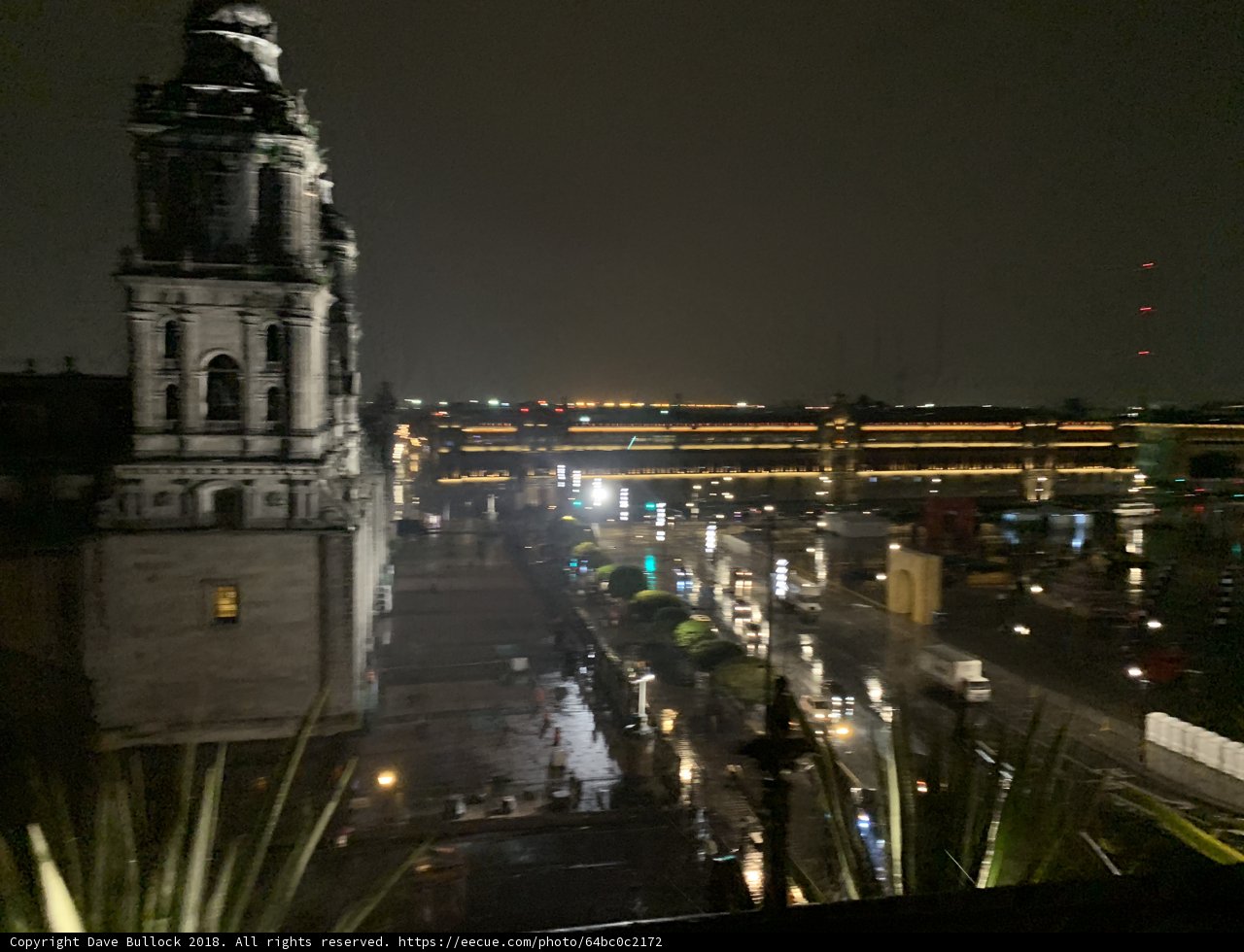Nighttime Cityscape with Illuminated Clock Tower in Cuauhtémoc