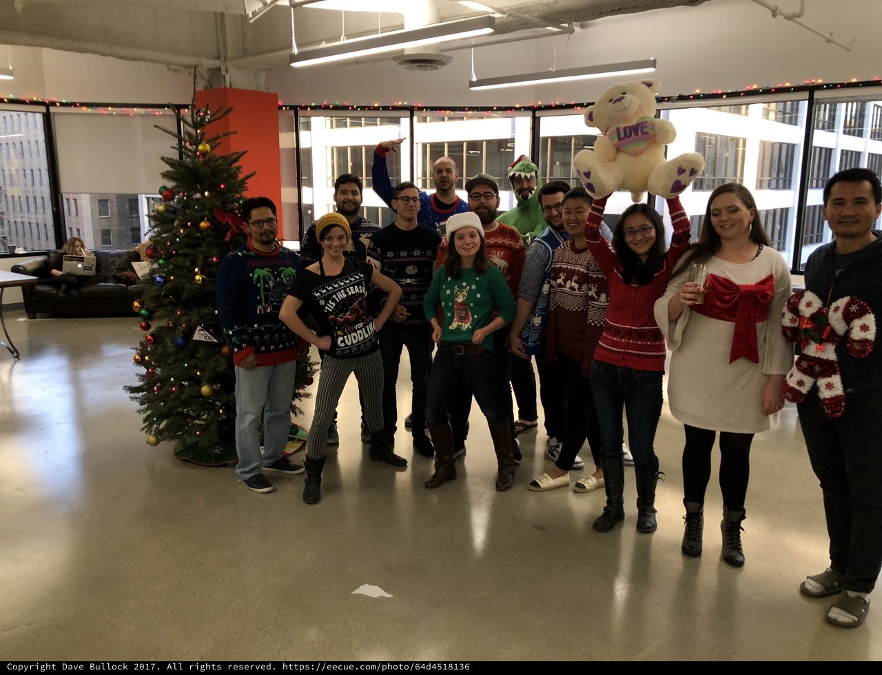 Office Team Celebrates Christmas in Ugly Sweaters