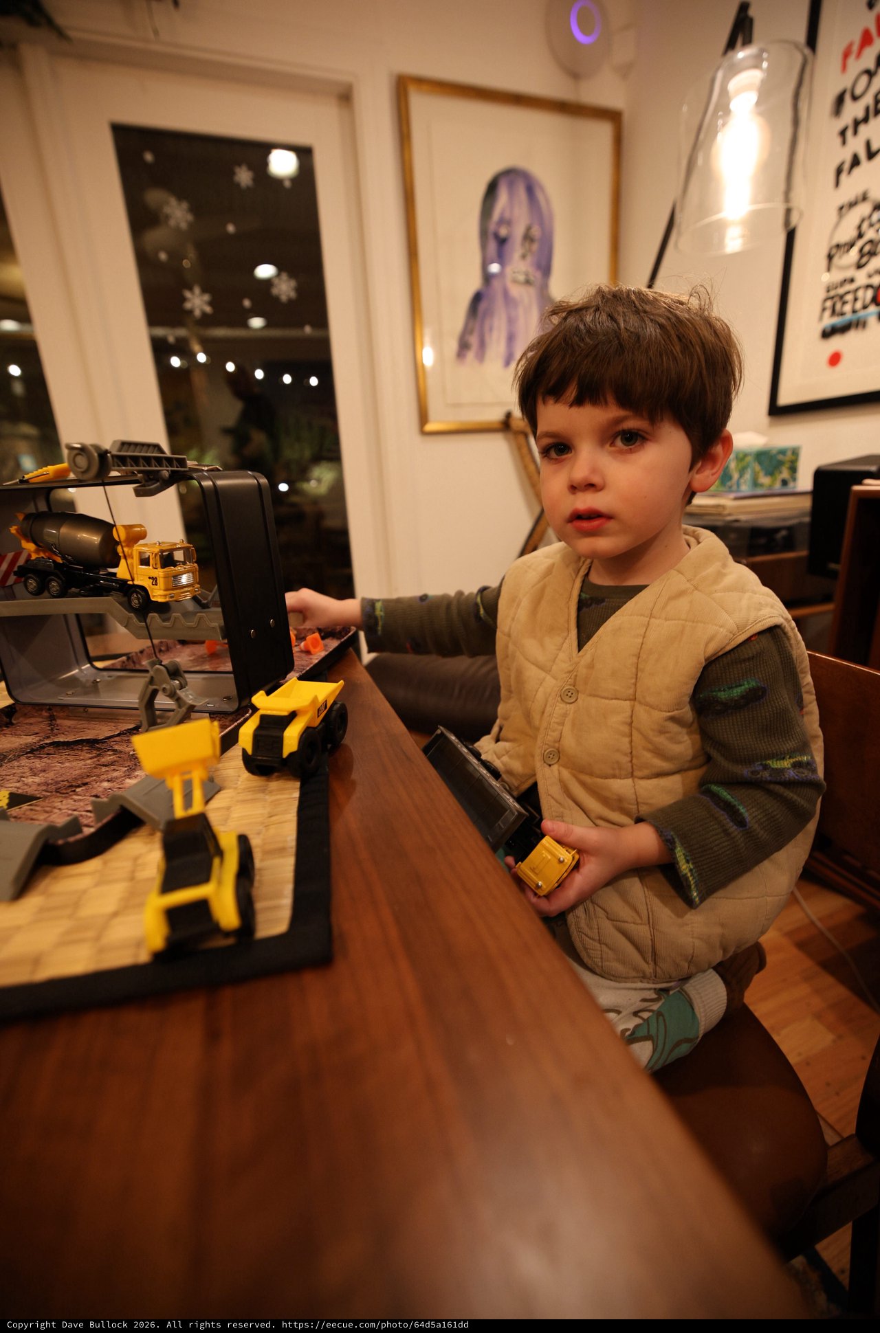 Young Boy Playing with Construction Toy Set at Home