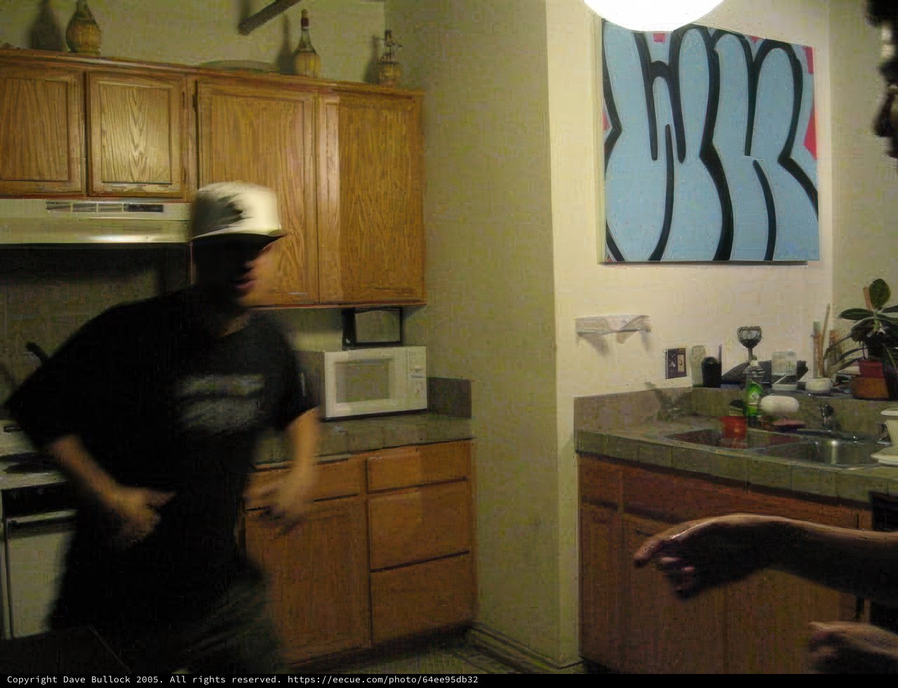 Man in the Kitchen Cooking with Microwave