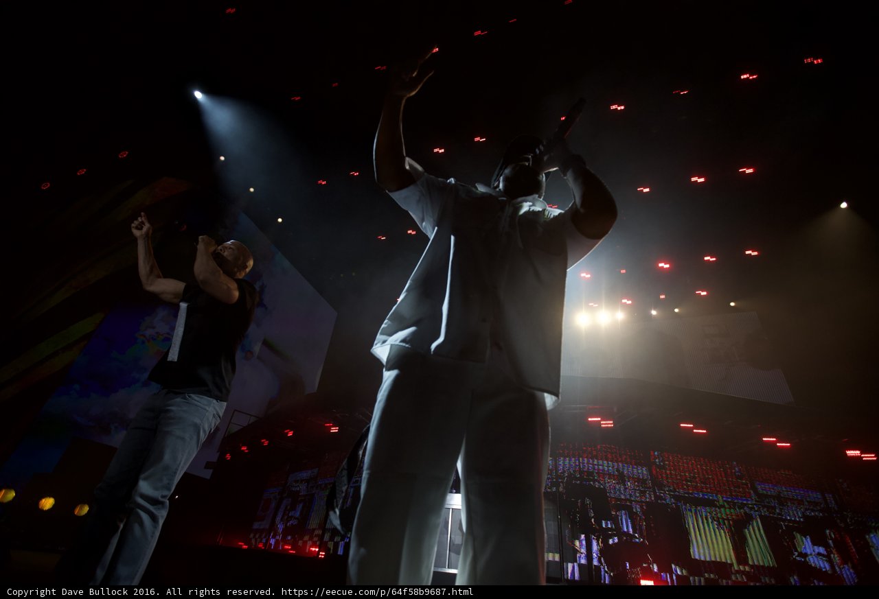 Rocking the Stage Caption: Common and his partner perform at Coachella 2016, while the crowd is captivated by their electrifying performance.