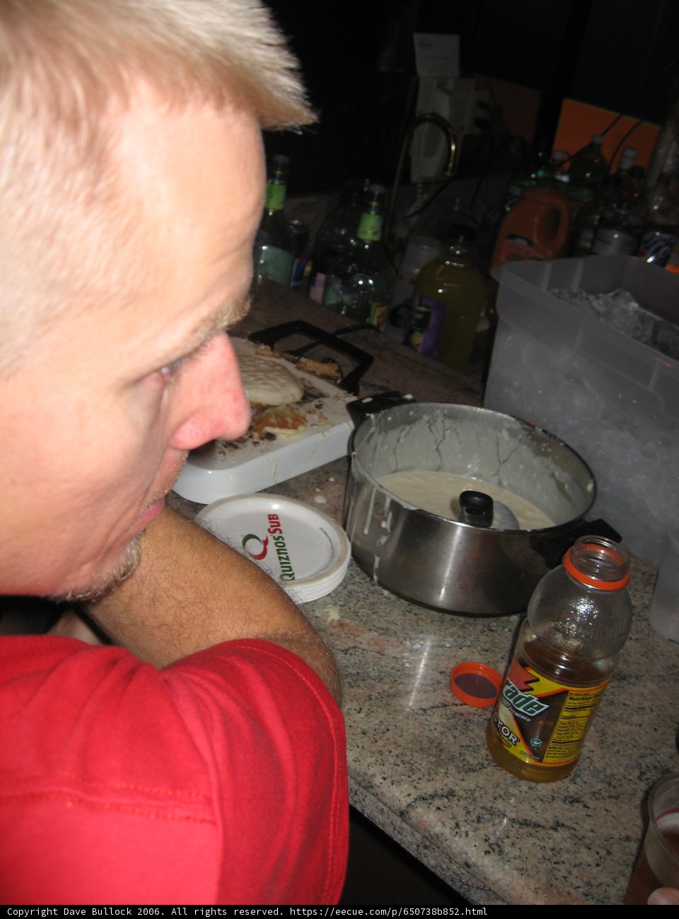 Red-Shirted Man Enjoys a Hearty Meal at the Pub