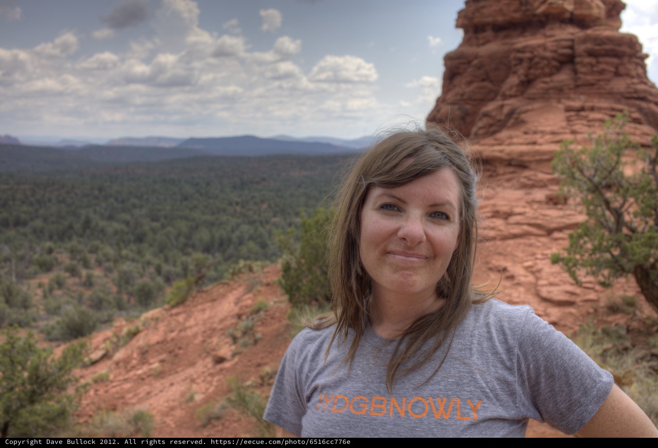 Woman Smiling Atop Sedona Red Rock Formation