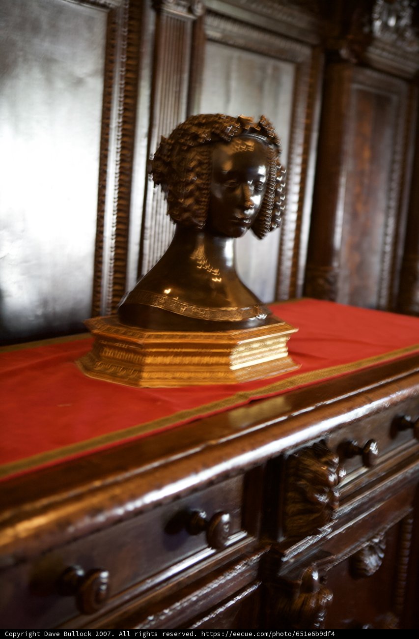 Serene Statue on Scarlet Sideboard