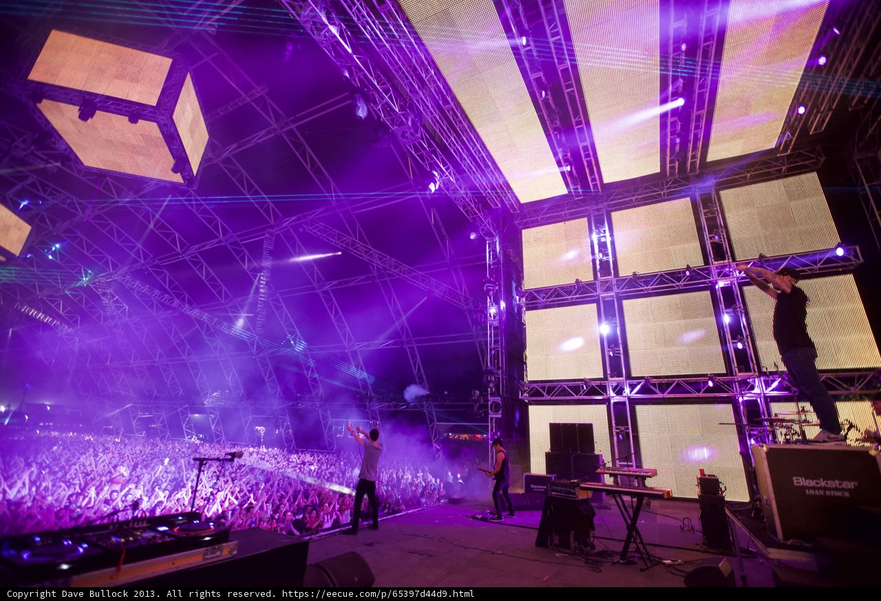 Purple Spotlight on Rock Concert Performance