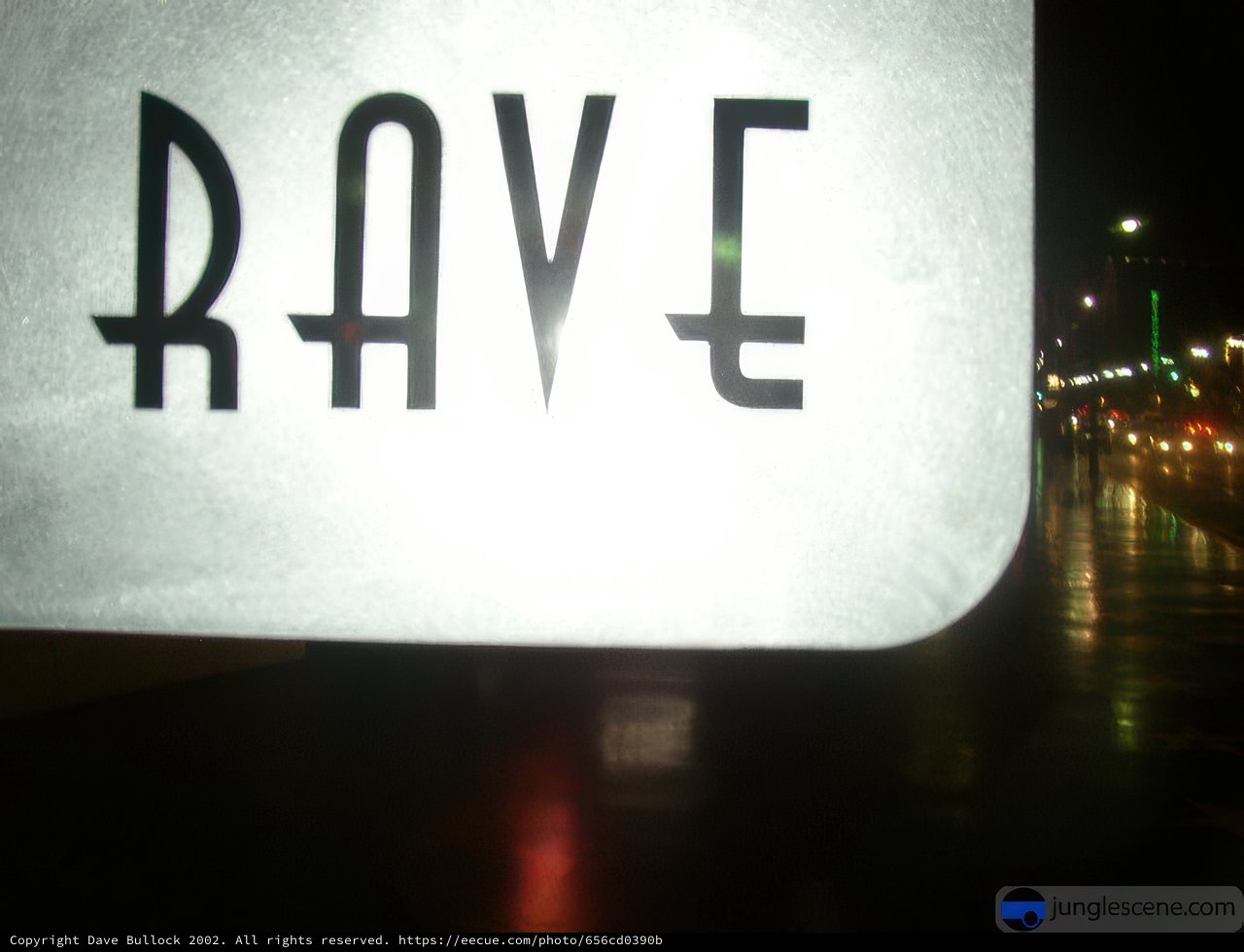 Neon Rave Sign Lights Up City Skyline
