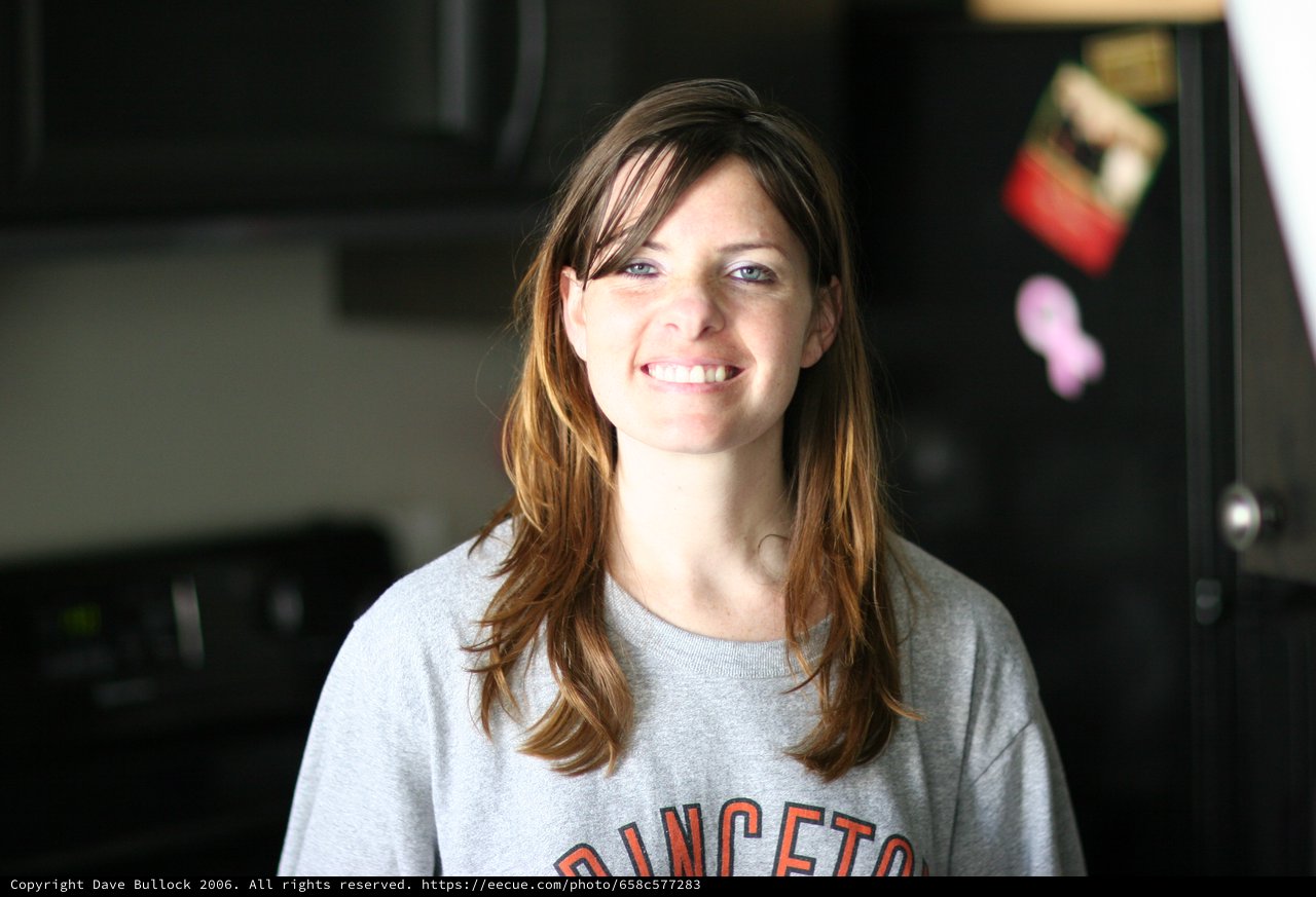 Smiling Woman in Princeton Sweatshirt at Home