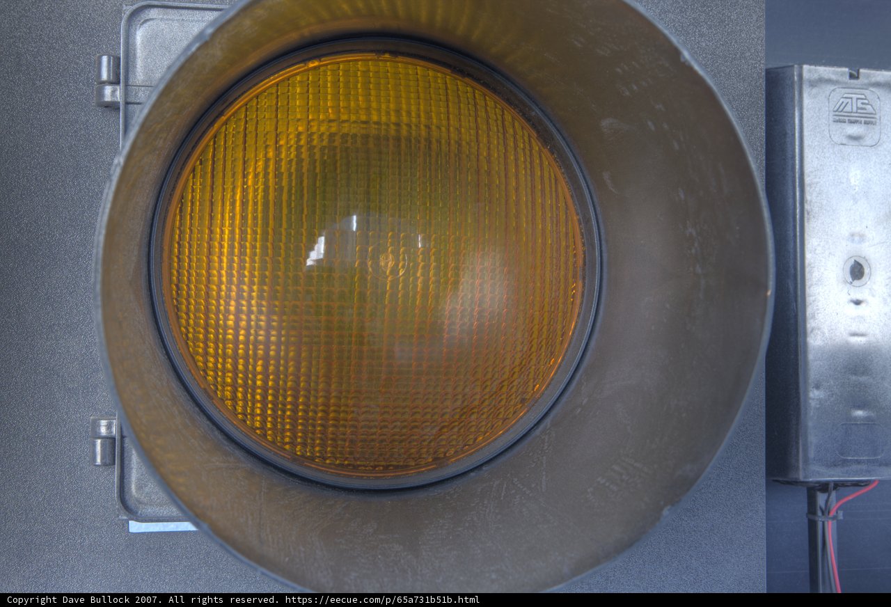 Illuminating Yellow Traffic Light