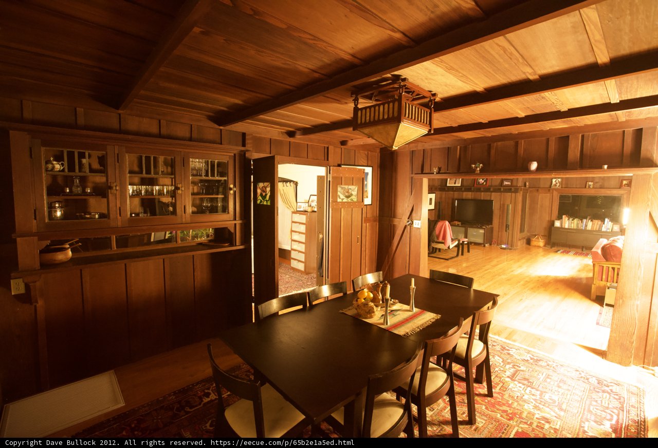 Wooden Dining Room with Hardwood Flooring and Nine Chairs