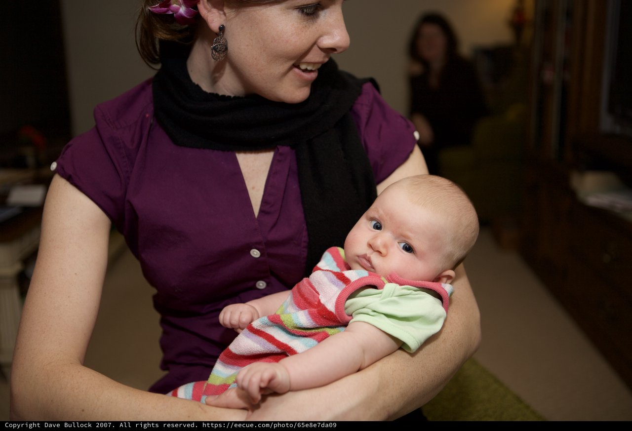 Mother's Smile: Tender Moment with Newborn Baby