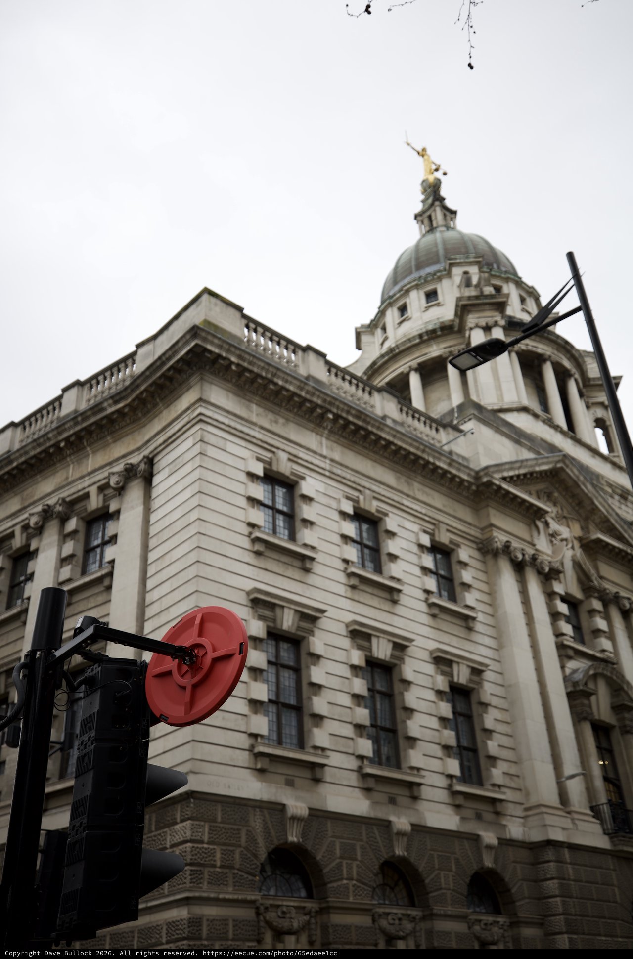 Historic London Building with Golden Dome Under Overcast Sky