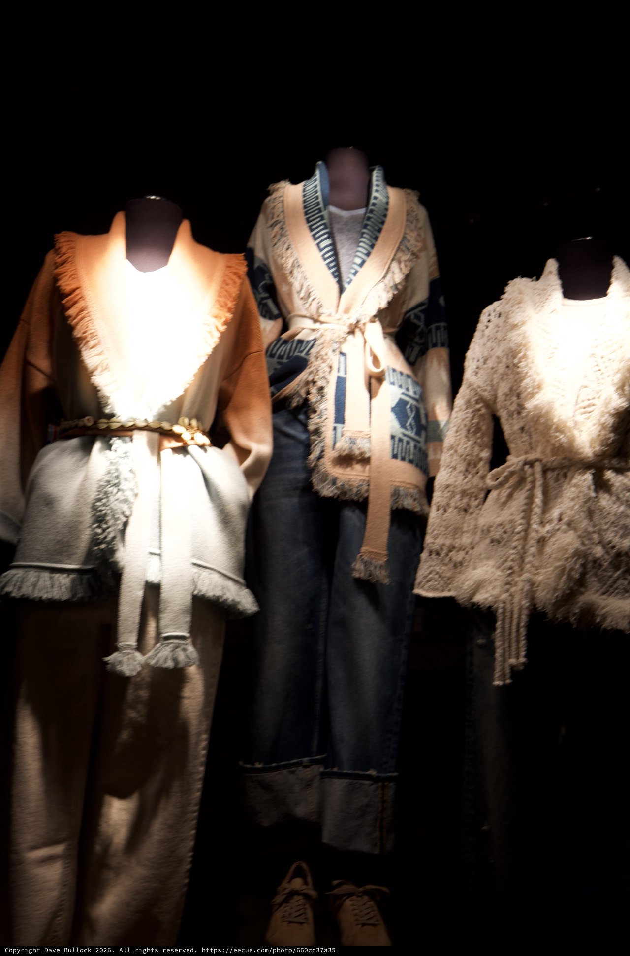 Luxurious Fur-Trimmed Winter Fashion Display on Mannequins