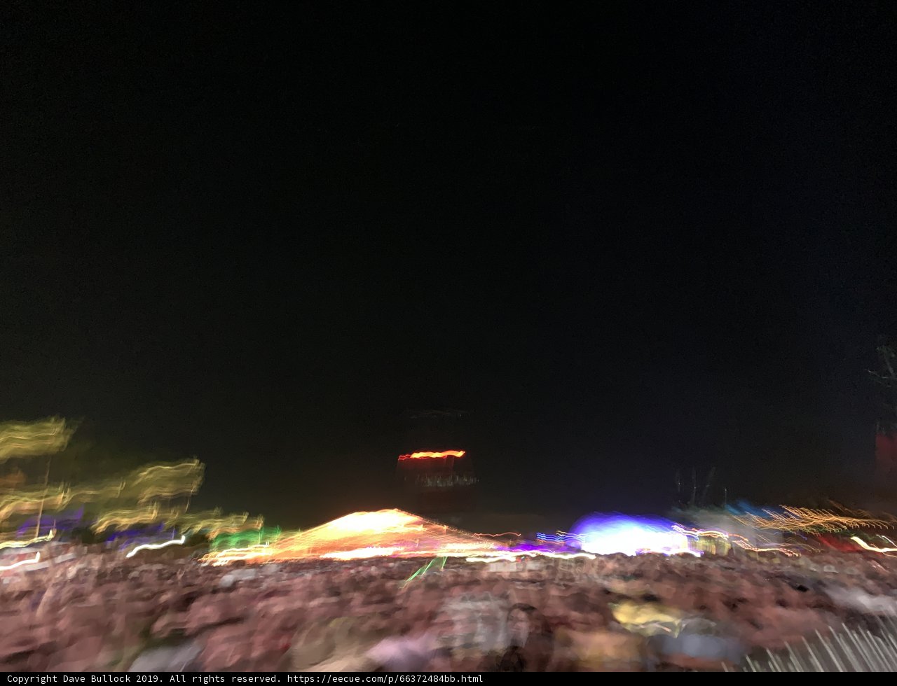 Blazing Night Sky at Music Festival