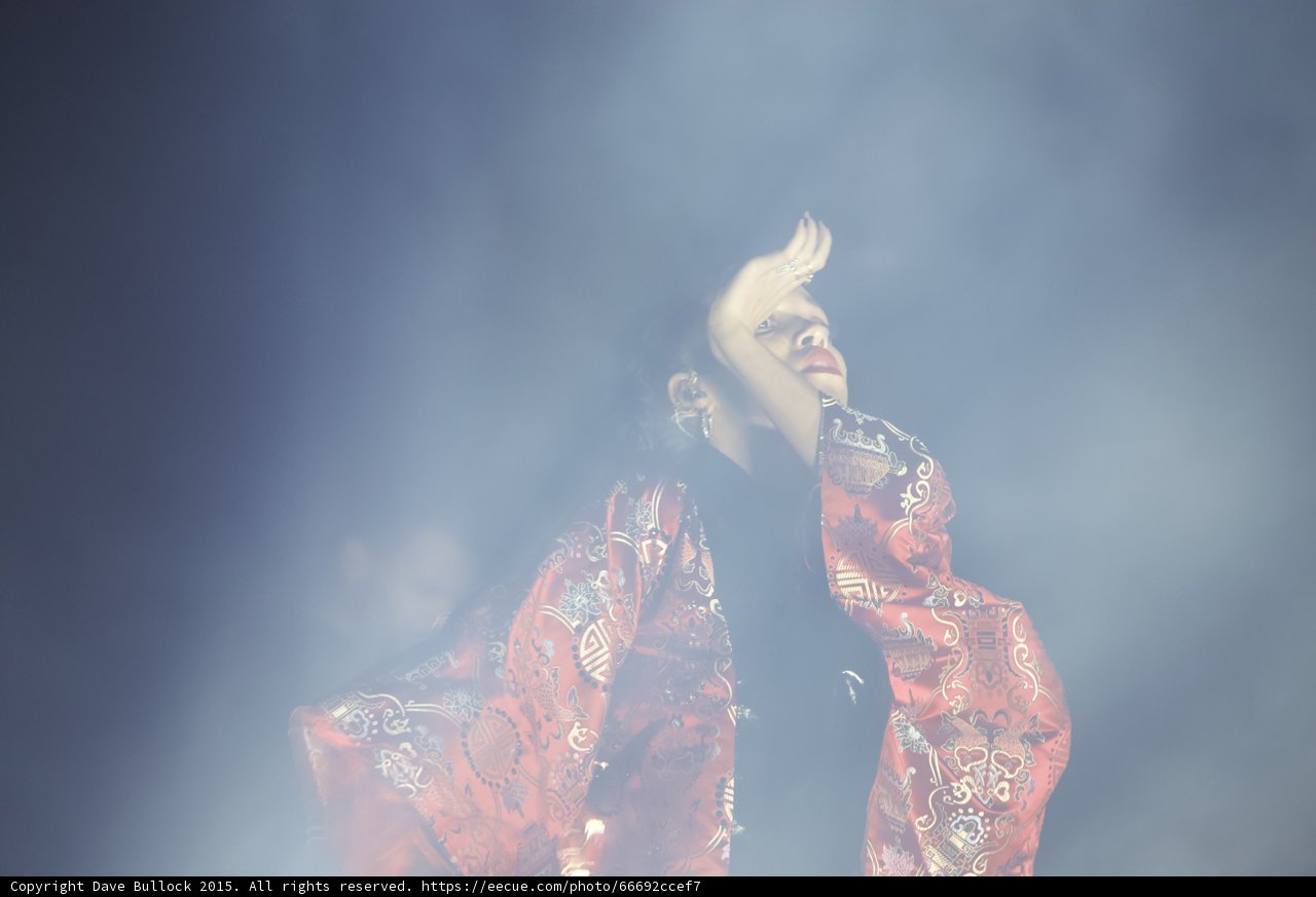 FKA twigs Dramatic Pose Looking Upward Motion Blur Hand Red Brocade Kimono Hoop Earrings Ethereal