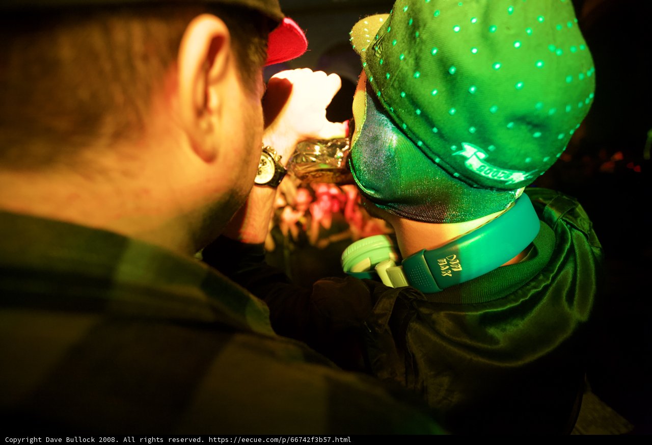 Green Hat Performer Takes the Mic