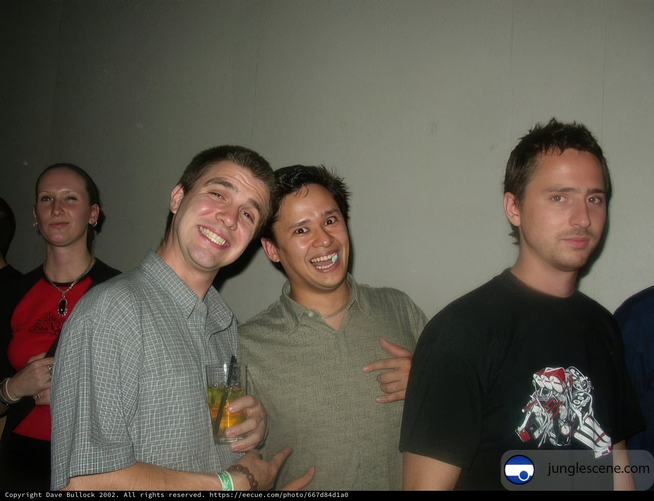 Group of Four Men With Drinks and Accessories