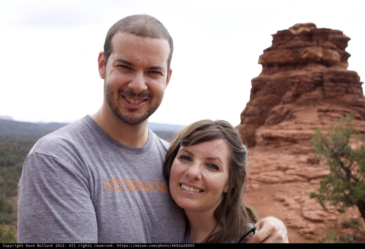 Couple Smiling Before Sedona Red Rock Formation