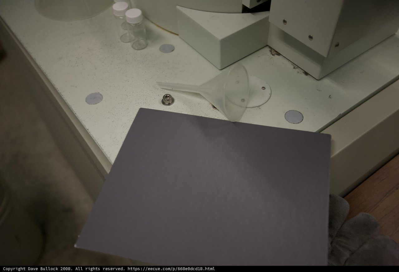 White Object on Plywood Table