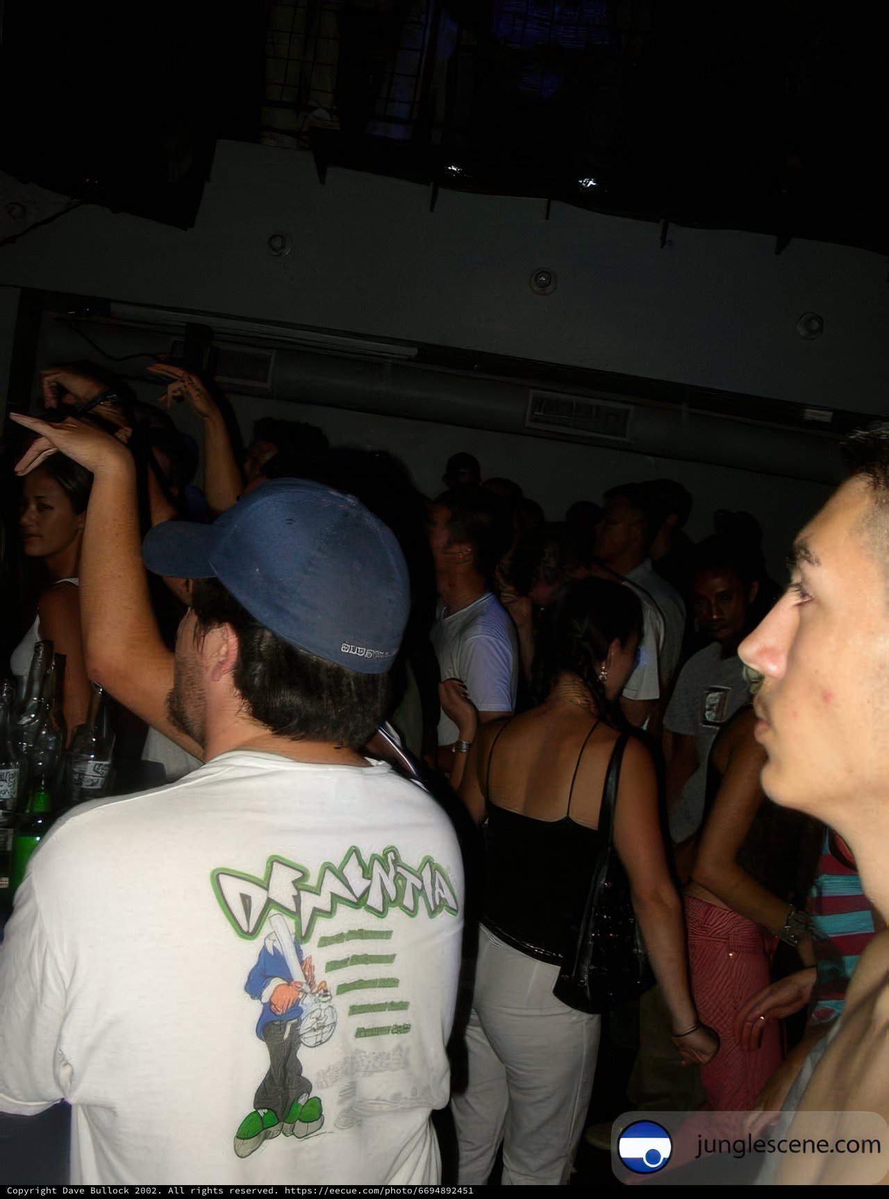 Nightclub Partygoer in Baseball Hat