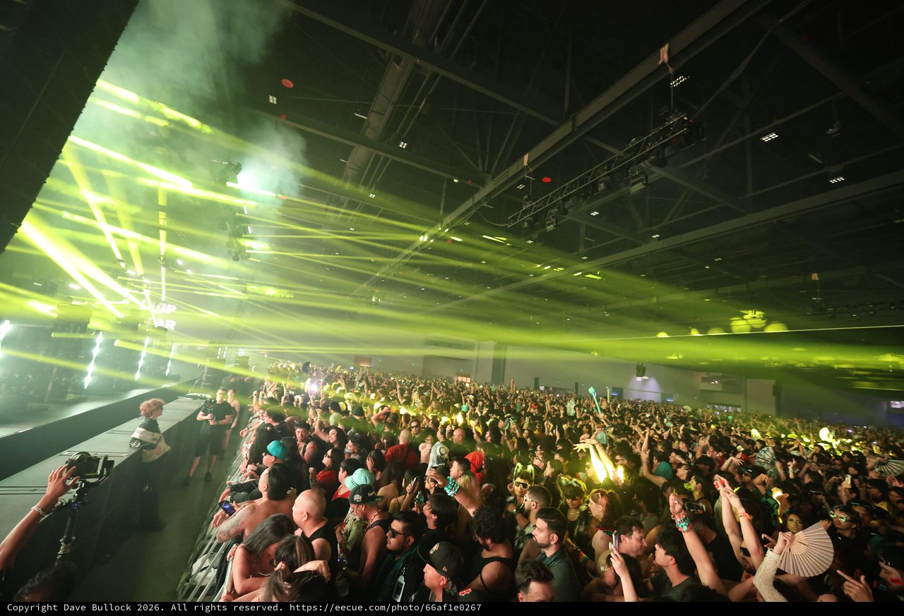 Massive Crowd Electrified by Green Laser Light Show
