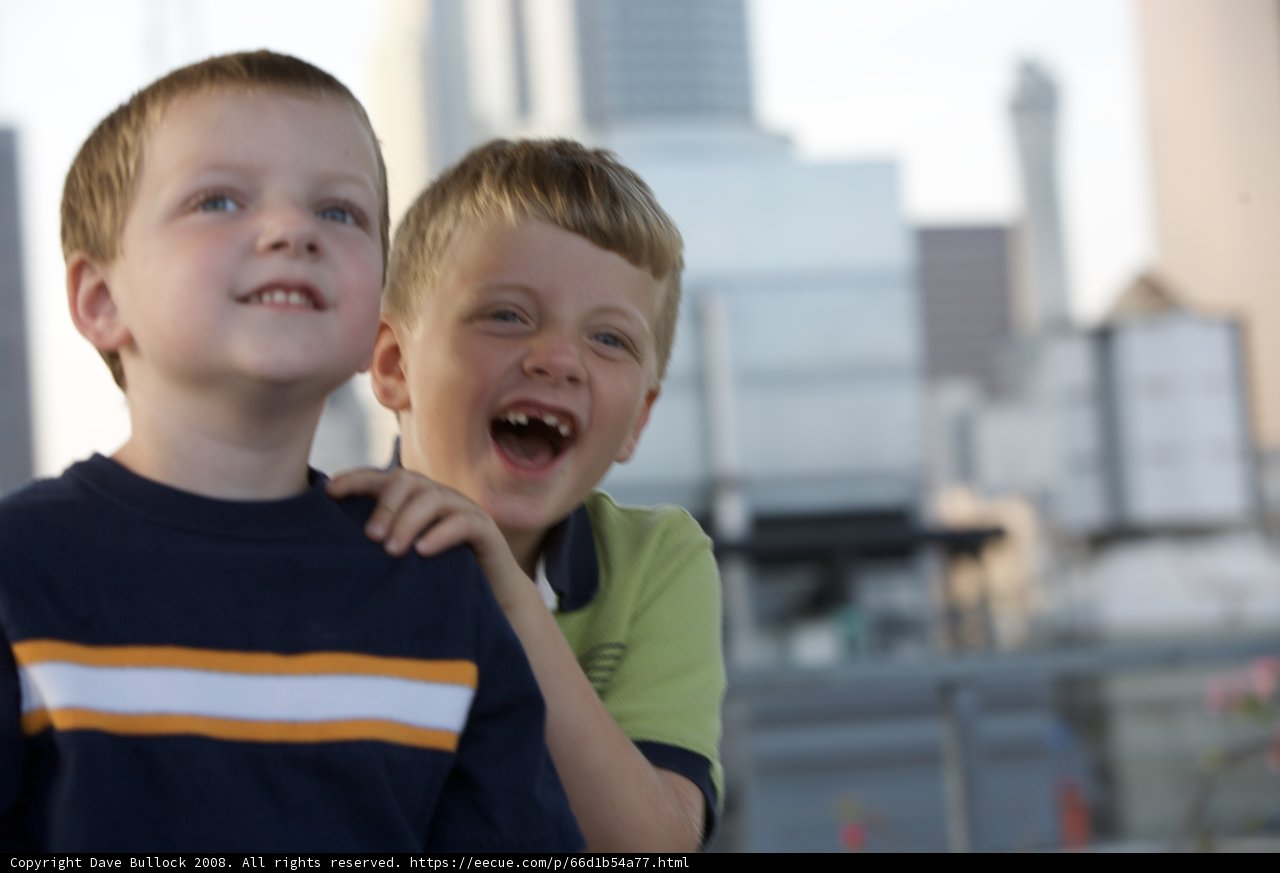 Joyful duo admiring cityscape