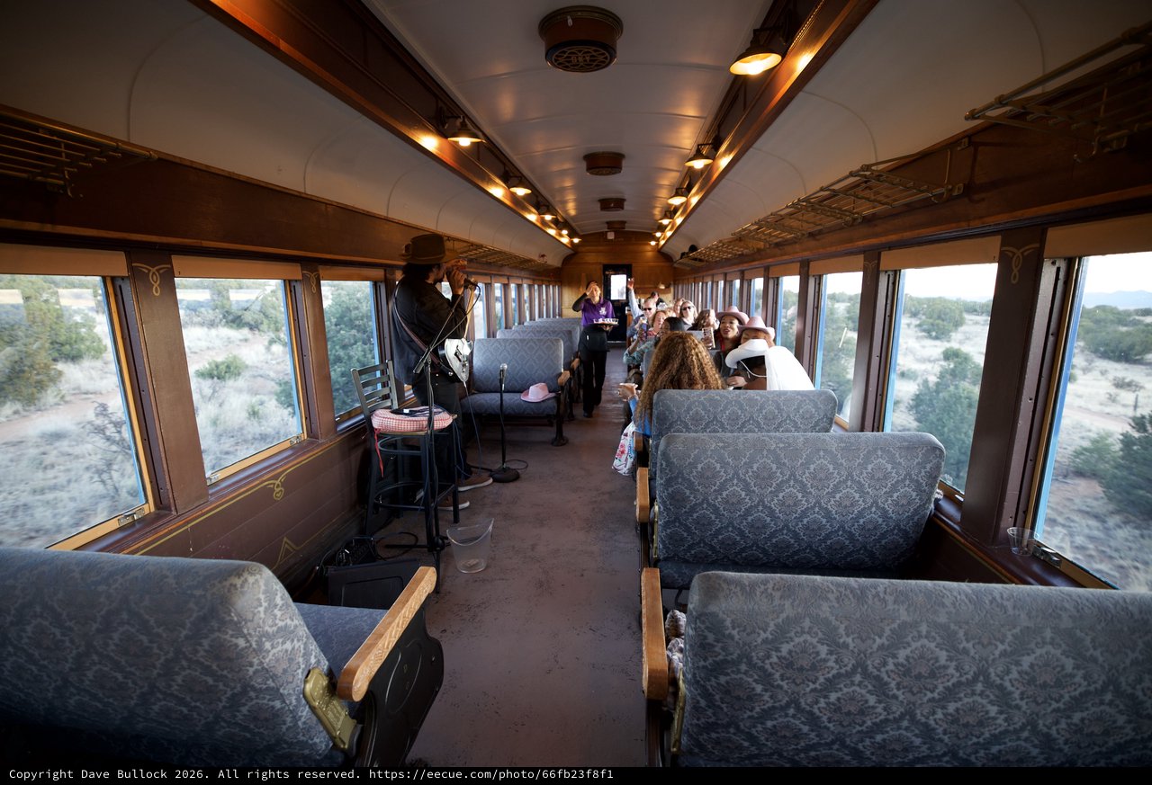 Vintage Train Car Entertainment Experience in Desert Landscape