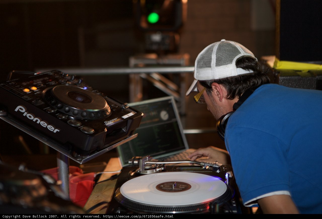 Blue Shirted DJ Entertains Crowd