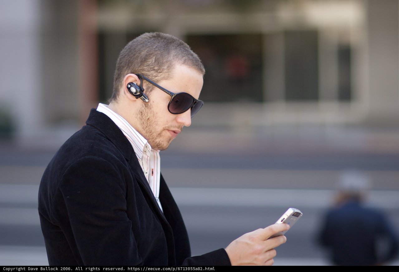 Sunglasses, Suit and a Mobile Phone