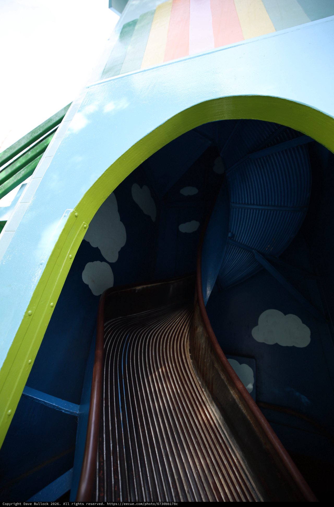 Whimsical Rainbow Slide Through Pastel Sky Portal