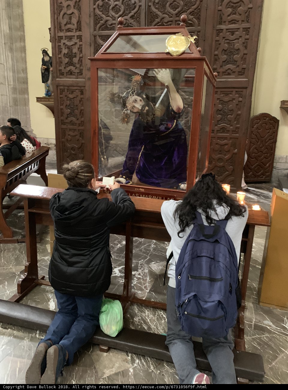 Prayer in Front of Statue