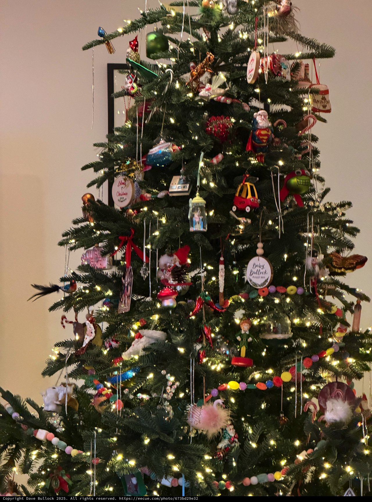 Festively Decorated Christmas Tree with Eclectic Ornament Collection