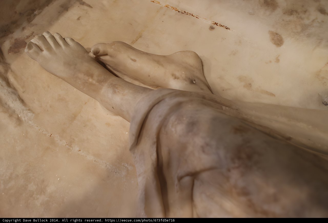 Sculpted Feet in a Cross Room