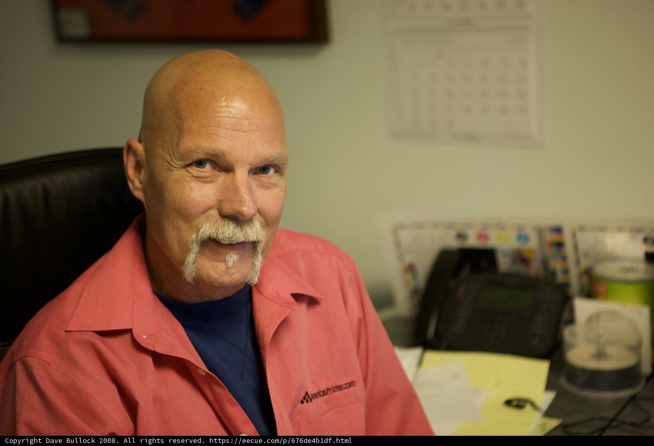 Bald Man at His Desk