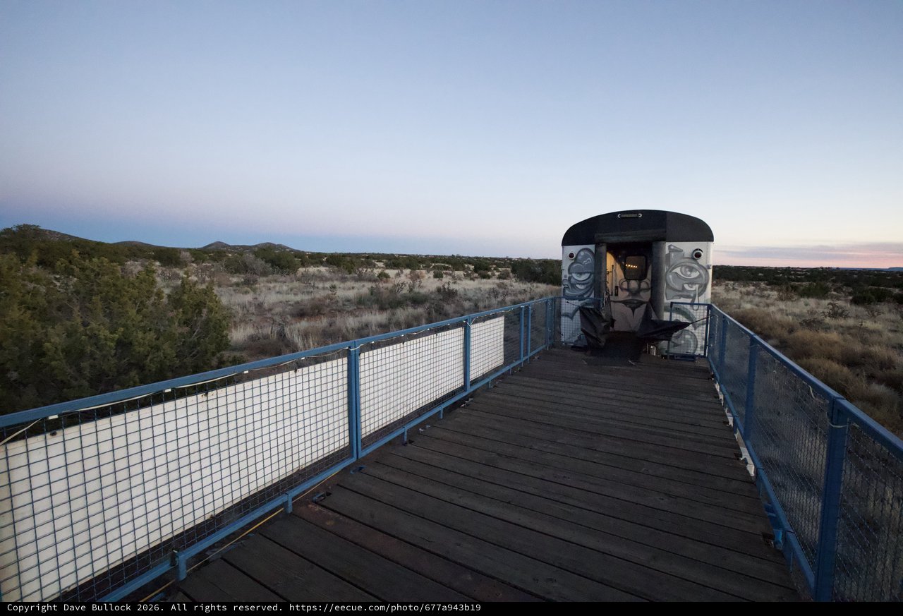 Abandoned Train Car on Desert Observation Deck at Twilight