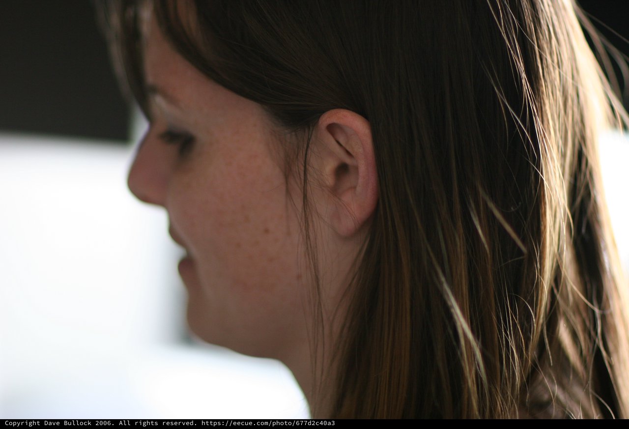 Profile Portrait of Young Woman with Freckles