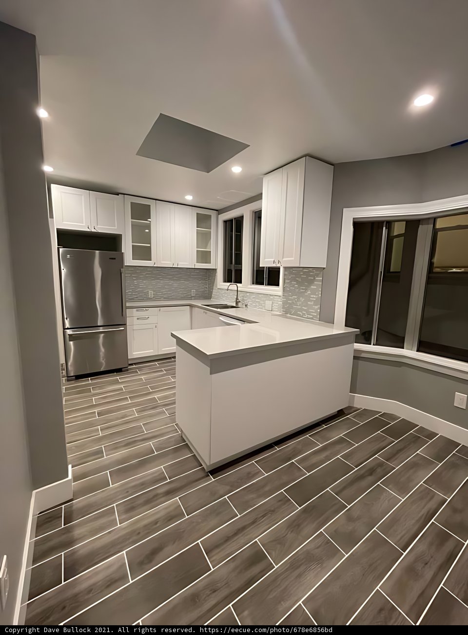 Modern White Kitchen with Tile Flooring