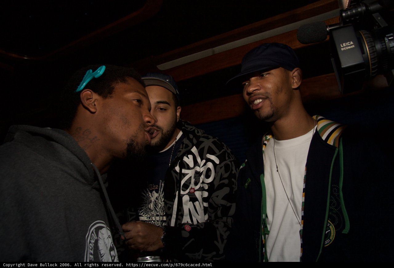 Three Men in Conversation