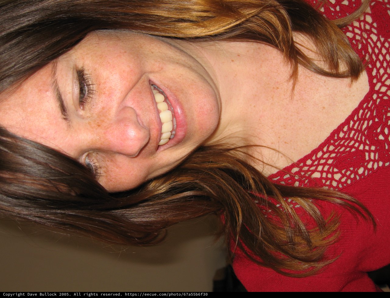 Joyful Woman Smiling Downward on Christmas Day