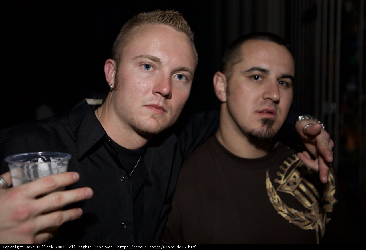 Two Men Cheersing at a Party
