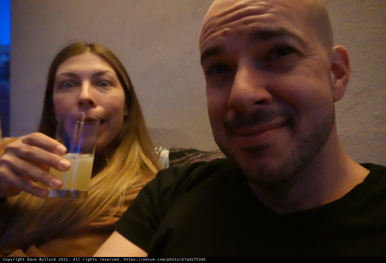 Couple Enjoying Drinks Together at Restaurant