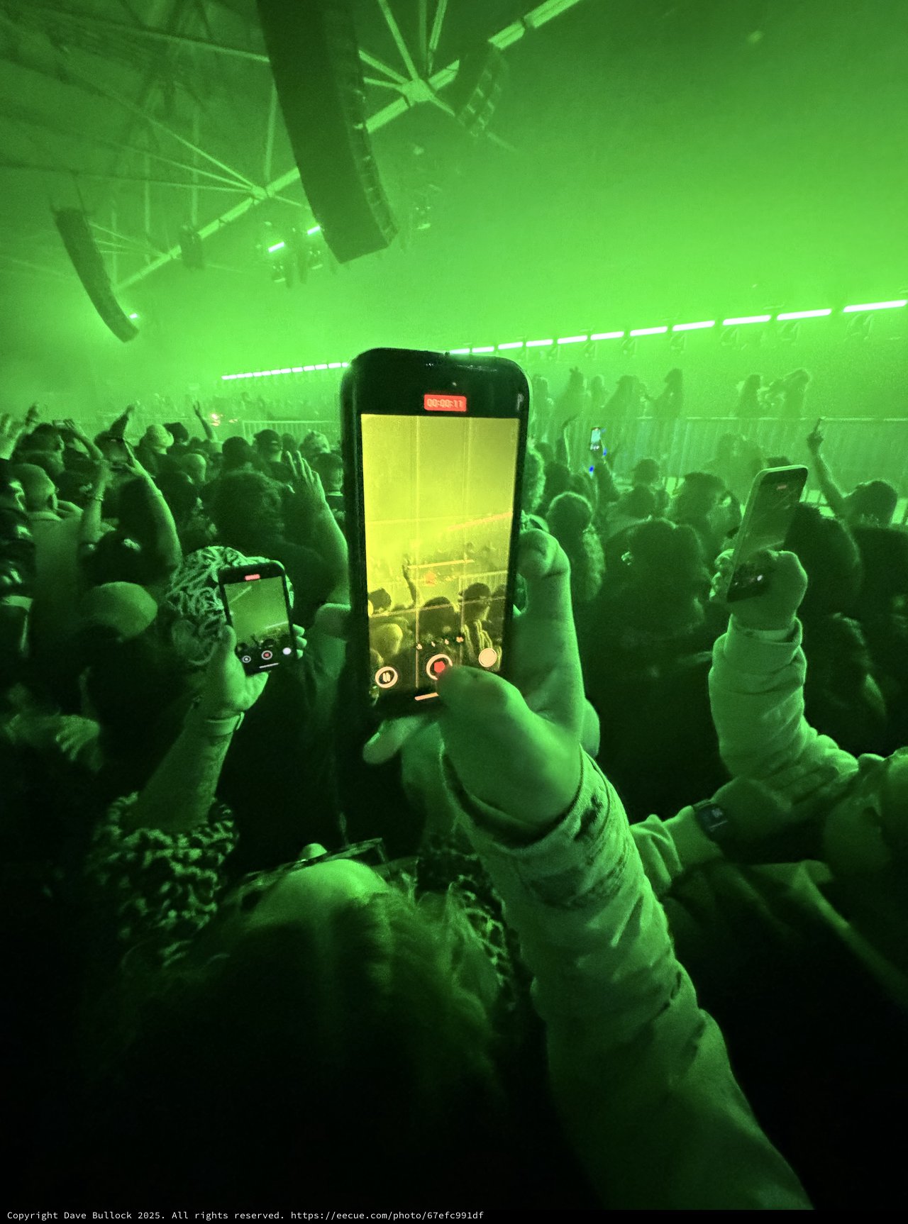Recording a Concert Through Phone Screen in Green Light