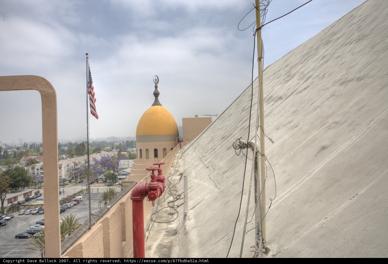 Flag Flying High Above Historic Building