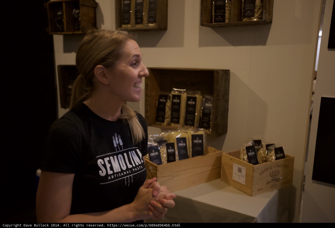 A Woman Selecting Plywood Shelves for Coffee Display