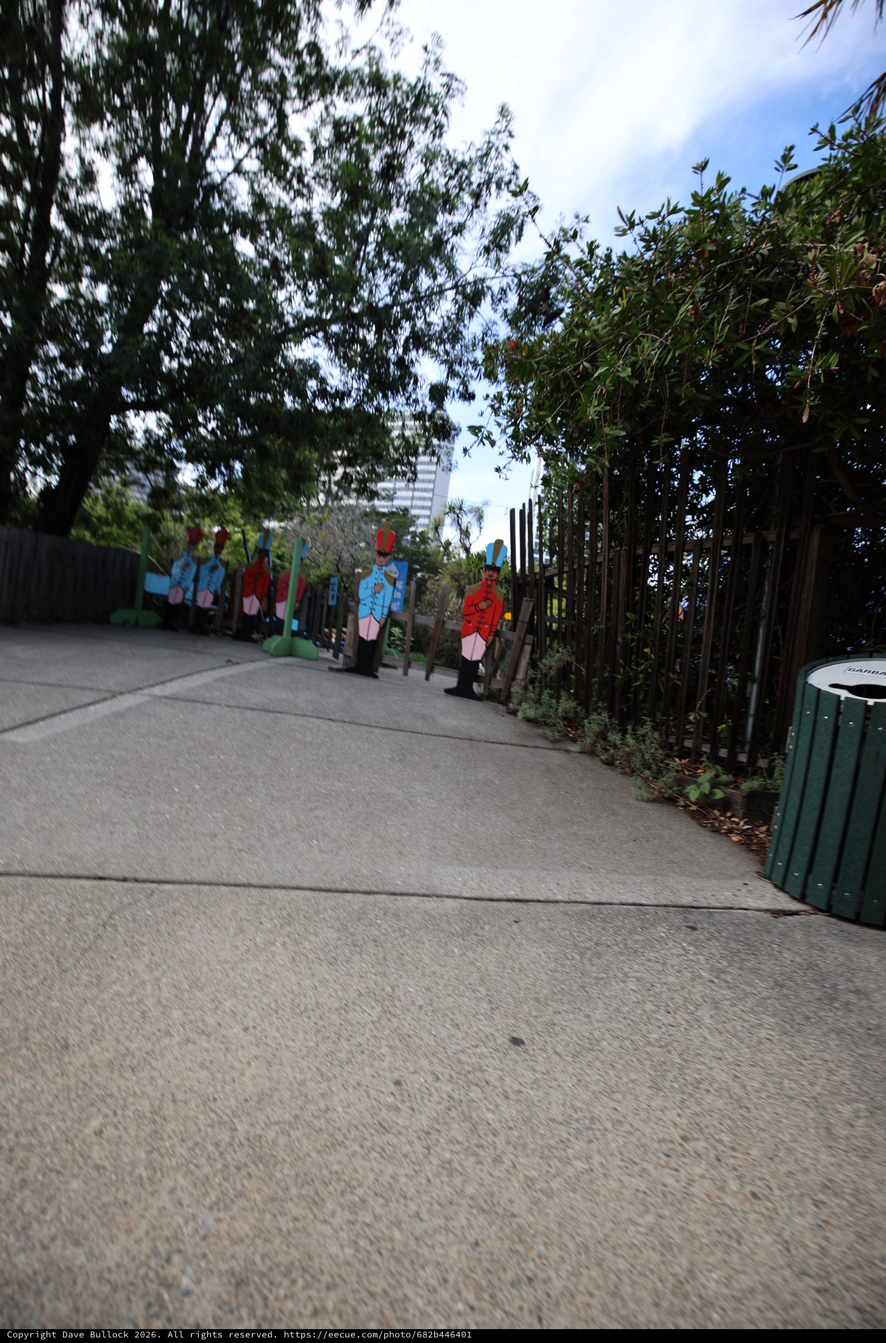 Colorful Character Cutouts Along Garden Pathway