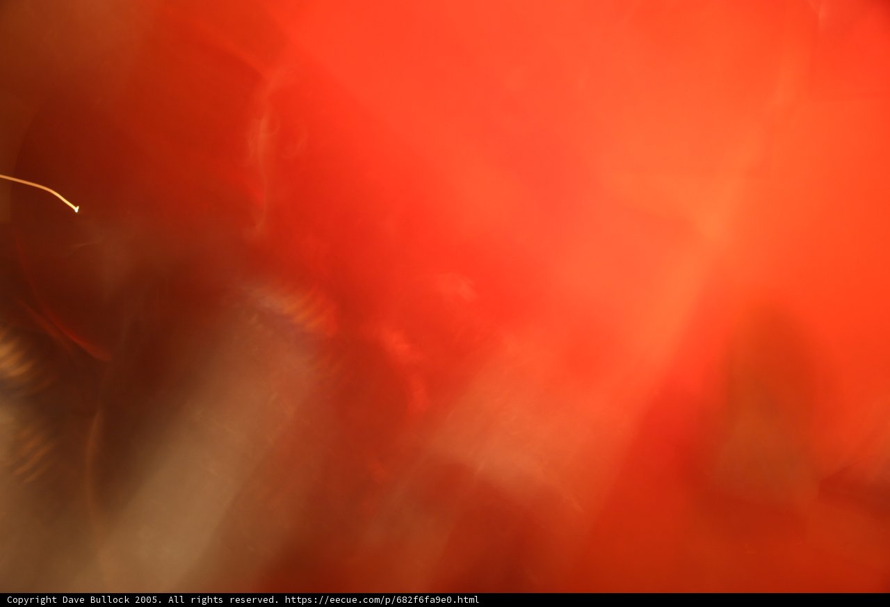 Blurry Red Light in Concert Crowd