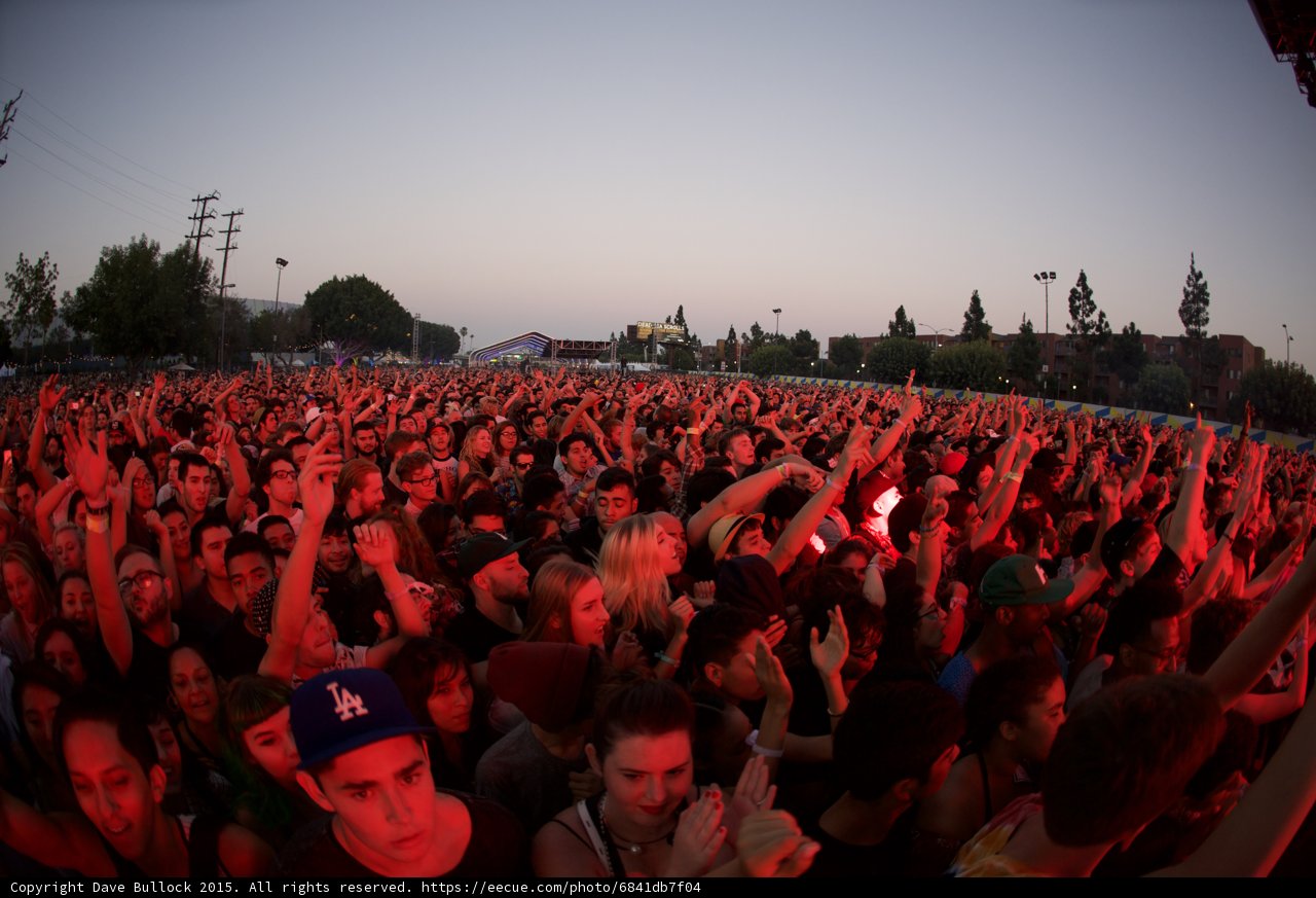 Crowd Faces Red Glow