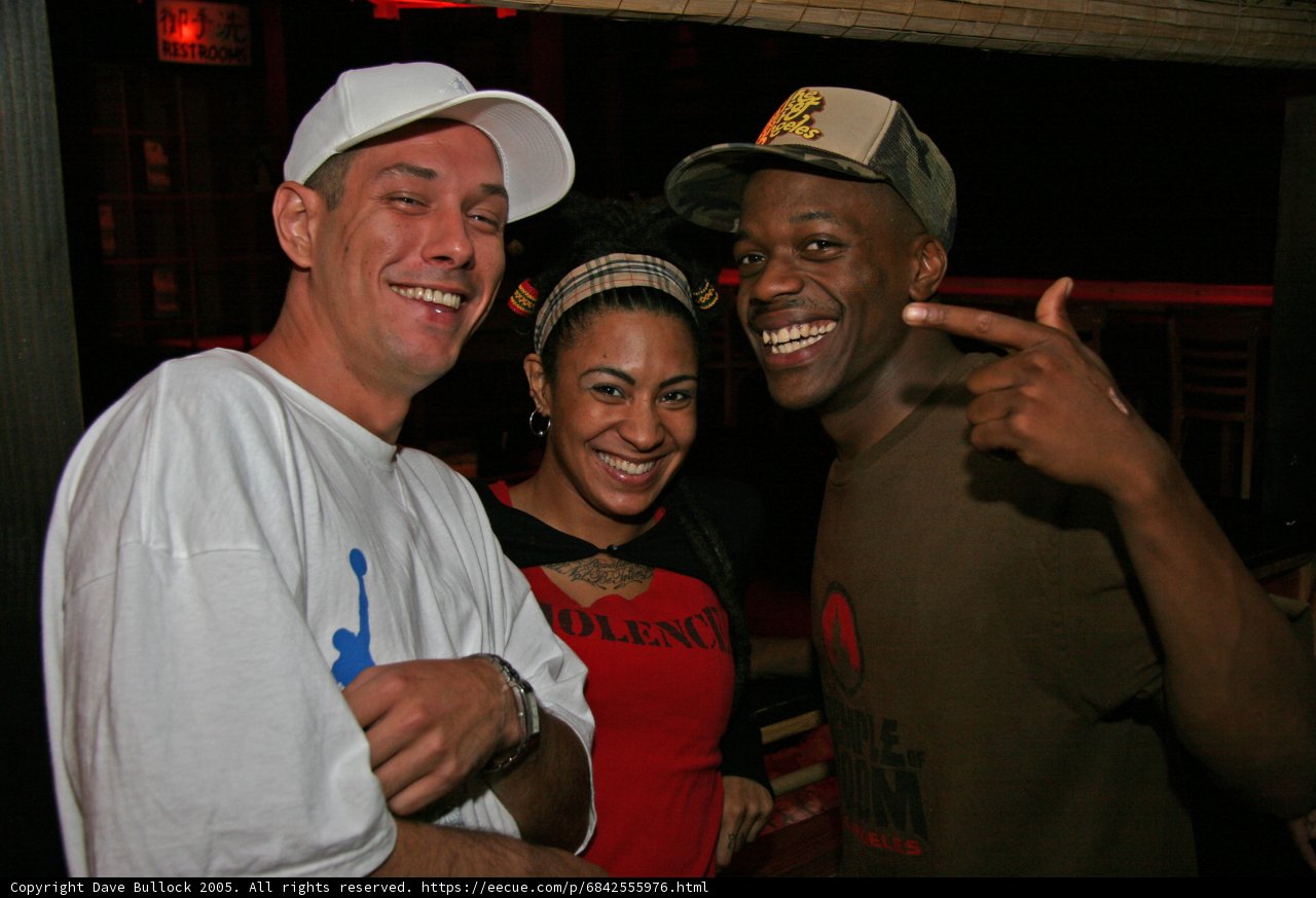 Three Friends Strike a Pose at the Club