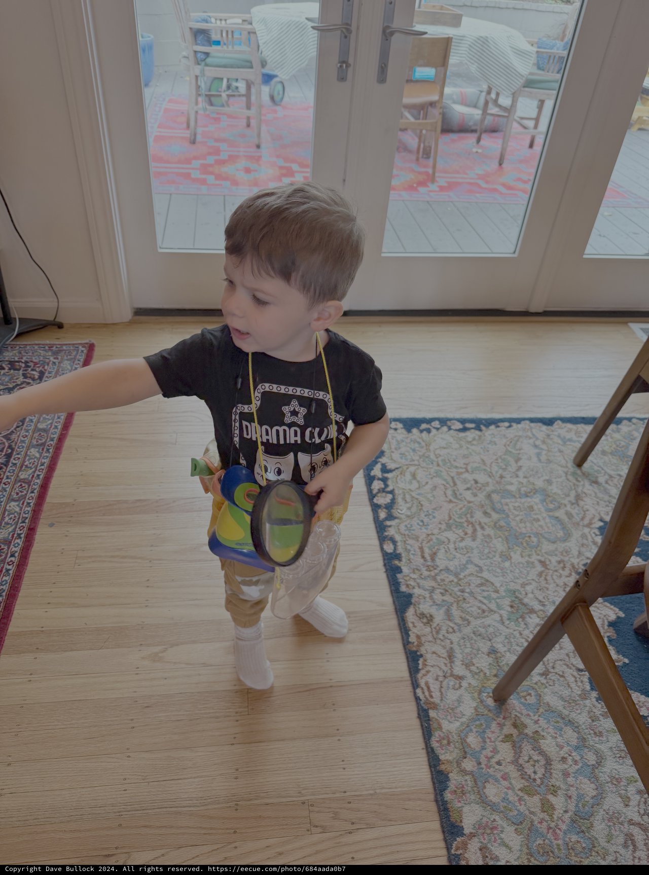 Young Child Playing Indoors with Toy