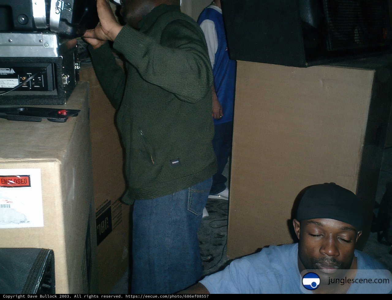 Green Jacket Man with a Box